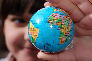 We only have one planet. Map of the world in a girl's hand